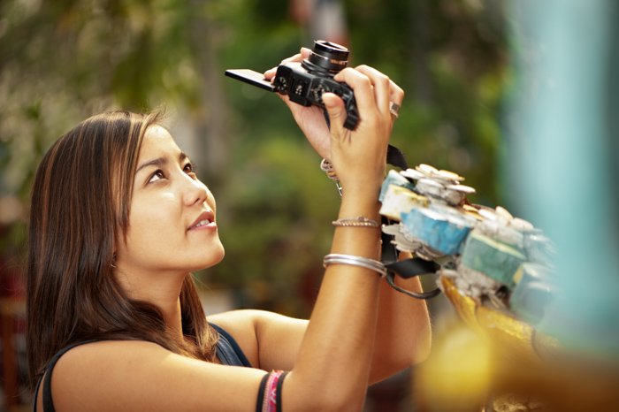 Photo of a woman taking a photograph