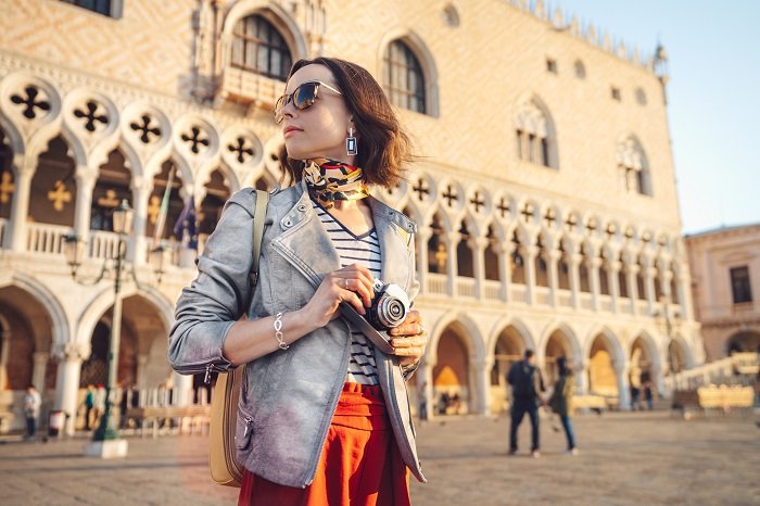 female photographer at a square in Venice
