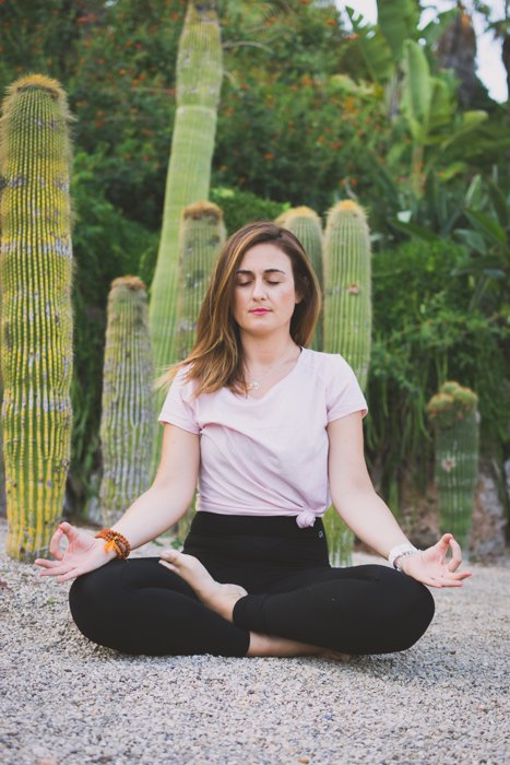 A girl meditating in Mossen Costa i Llobera Gardens - best locations for Barcelona photos