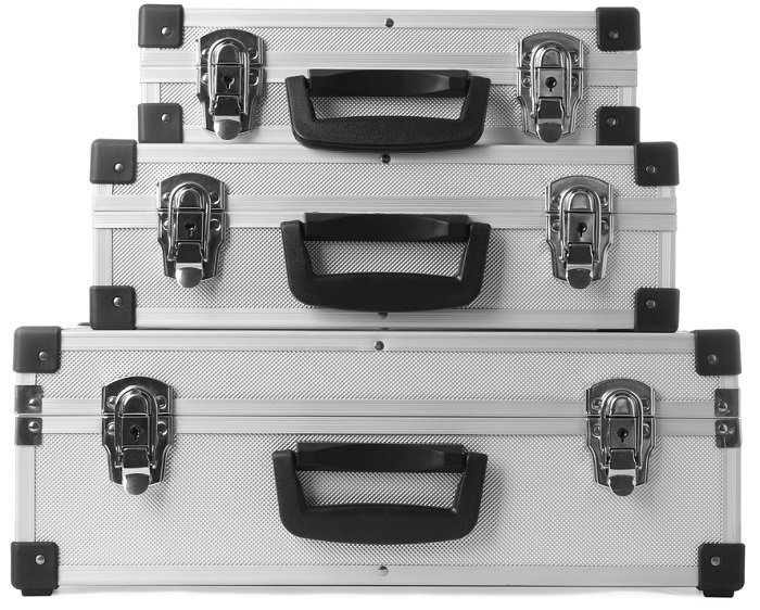 three aluminum hard camera cases stacked on top of each other