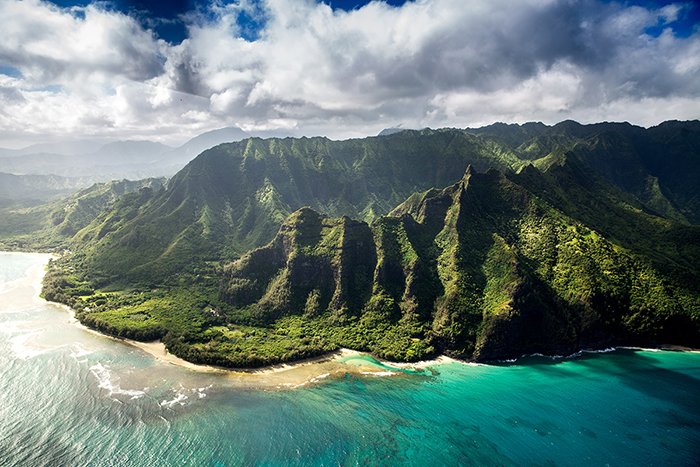 Beautiful green mountains surrounded by ocean