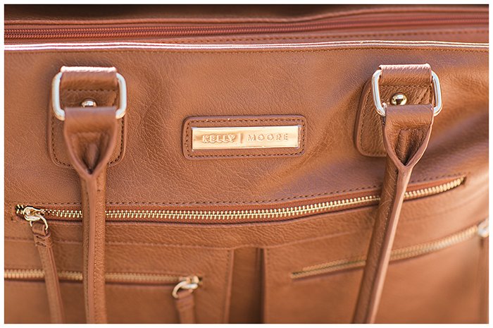 The logo of Kelly Moore Libby 2 Camera Bag.