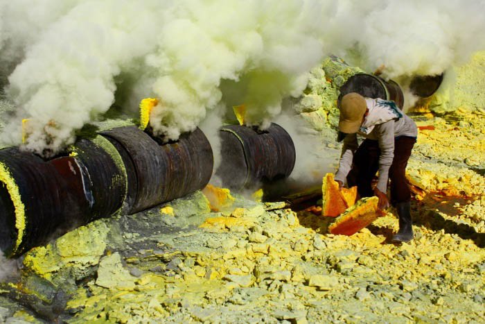 An image of a man mining sulphur - travel photography