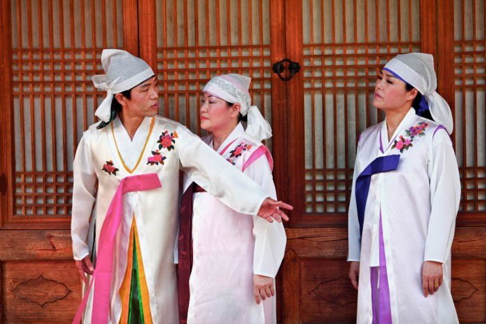 Three people dressed in traditional clothing