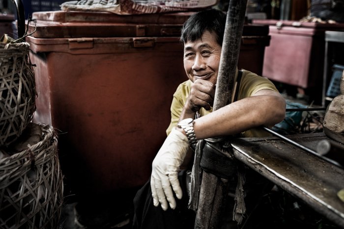 Documentary photography portrait of a man at Muang Mai Market, Chiang Mai, Thailand.