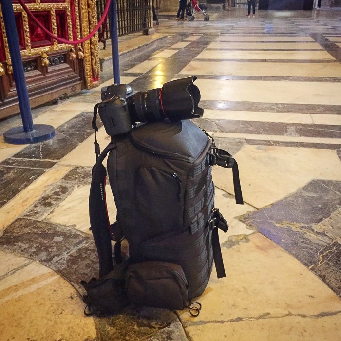 DSLR camera on a bag used as a tripod in a museum
