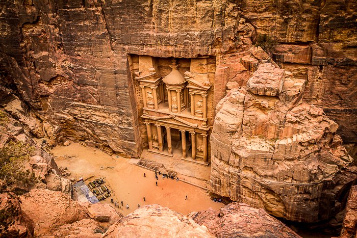 photo looking down at the carved pillars of Petra in Jordan