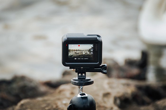 A gopro camera set up on a tripod