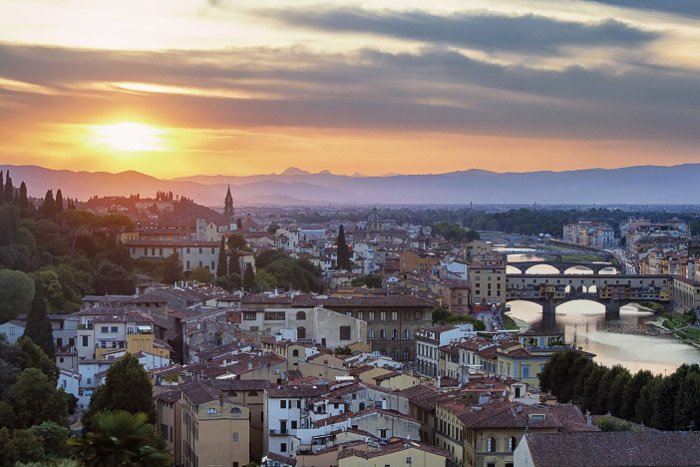 Aerial view of rooftops of buildings at evening time