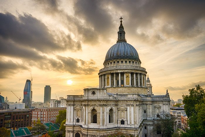 A cathedral against an overcast sky at sunset - travel photography jobs 