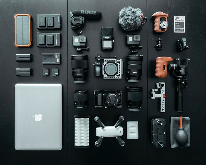 A flat lay of various camera equipment for Iceland photography