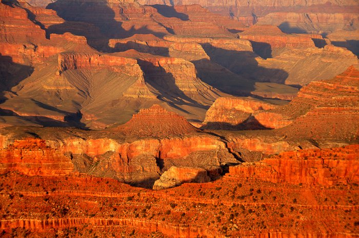 A vast canyon of red sedimentary rock - travel the world photography.