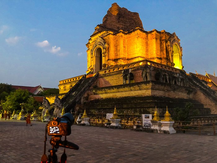 historical architecture in thailand. old temple lit from below, glowing in the dusk - dream photography places