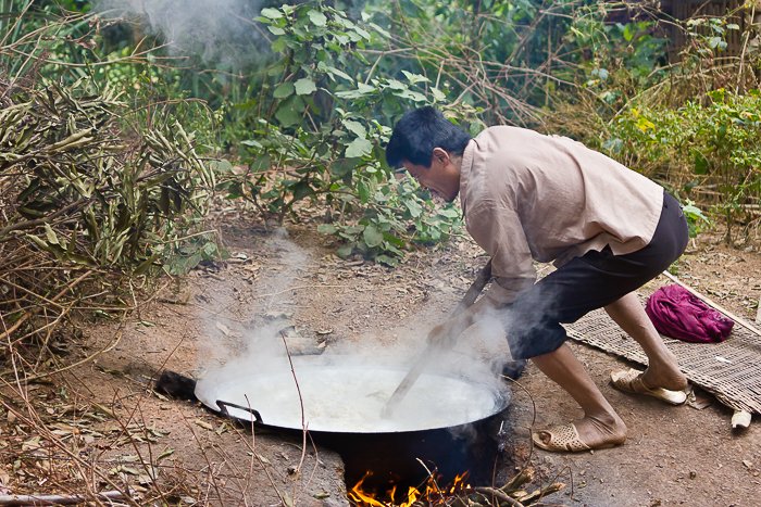 Man making rice whiskey at minority village in Mai Chau in Vietnam.