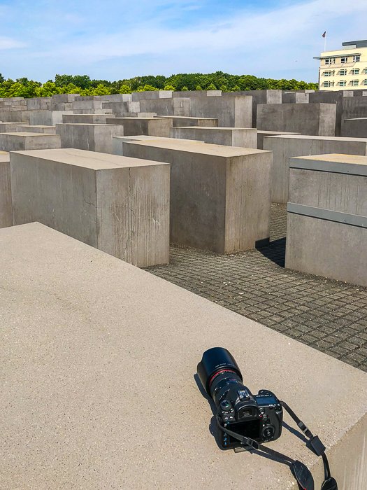 DSLR left alone on a stone slab in a memorial area