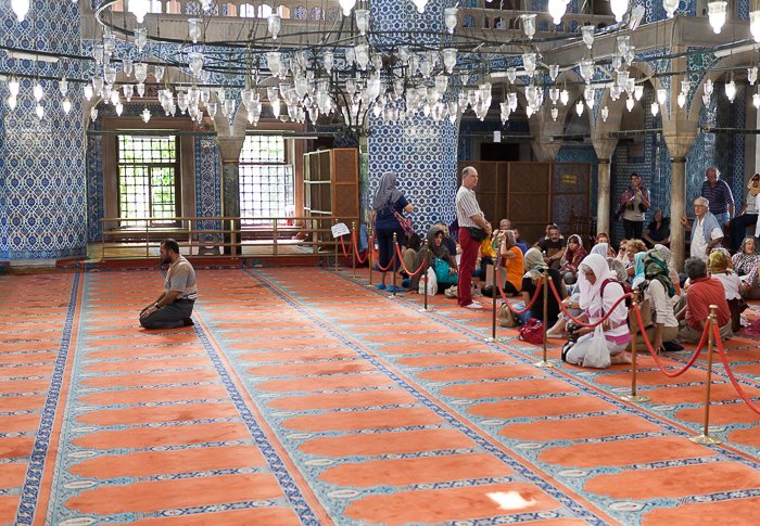 People praying in the Mosque of Rustem Pasa in Istanbul, Turkey